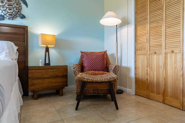 Curl up in the comfortable woven rattan lounge chair—perfect for a quick rest or settling in with your favorite book.