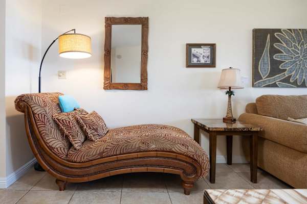 The chaise lounge invites you to stretch out, unwind, and enjoy a quiet moment of relaxation in comfort.
