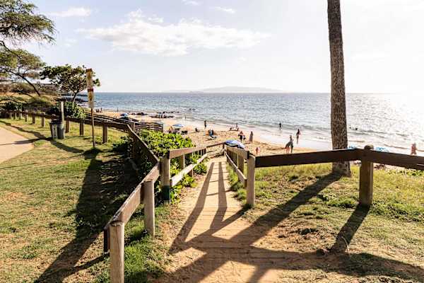 Soak in island bliss at Kamaole Beach Park—where guests can lounge on soft sands, snorkel in clear waters, and catch unforgettable sunset views just steps away.