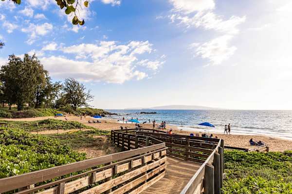Soak in island bliss at Kamaole Beach Park—where guests can lounge on soft sands, snorkel in clear waters, and catch unforgettable sunset views just steps away.