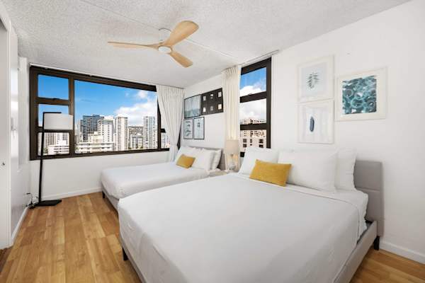 Bedroom with a queen and a full bed. Enjoy cool nights with the ceiling fan