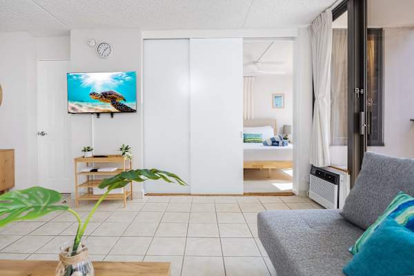 The bedroom is situated just right across the living room with a handy sliding door—easy to wander between spaces, or slide it shut for a cozy, private retreat.