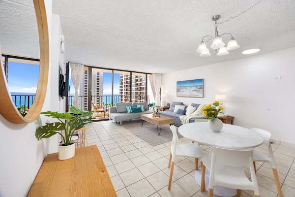 The dining table is conveniently placed beside the open living area—perfect for effortless meals, lively conversation, and seamless entertaining.