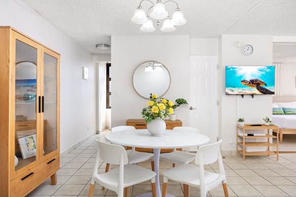 The dining table seats four—perfect for shared meals and lively conversations.