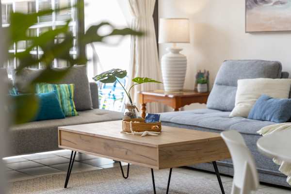 The living room is adorned by carefully selected decorative details that adds to its modern-minimalist styling.