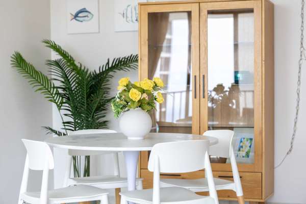 The dining table seats four—perfect for shared meals and lively conversations.