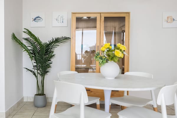 The dining table seats four—perfect for shared meals and lively conversations.