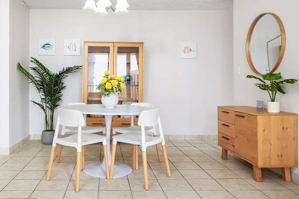 The dining table seats four—perfect for shared meals and lively conversations.