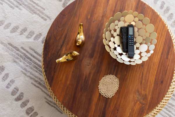 Round wood coffee table centerpiece w/ decorative tray & TV remote