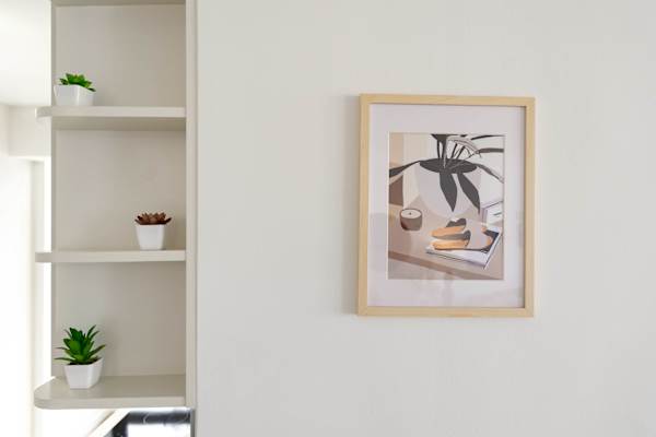 Wall art & built-in shelving adding a stylish touch