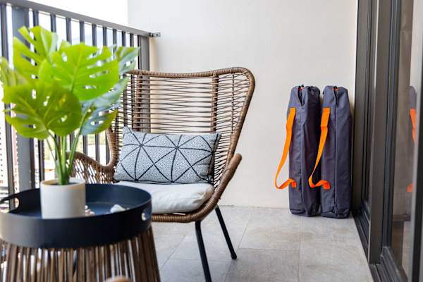 Balcony seating nook w/ chair & small table for relaxing outdoors