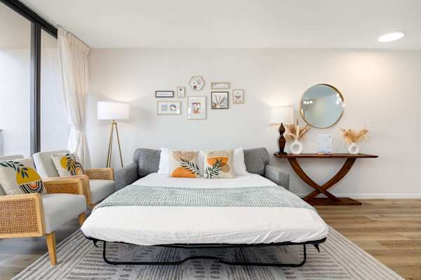 Living room sofa converts into a bed, creating flexible sleeping space