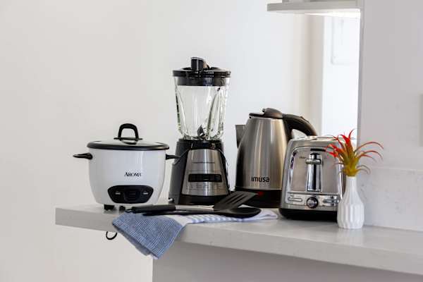Small appliance station w/ blender, kettle, toaster & rice cooker for quick meals