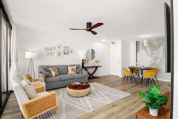 Bright living space w/ comfy seating, dining area & modern coastal décor