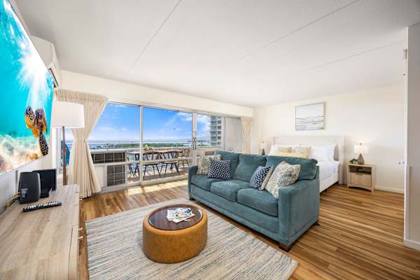 Check out this modernly designed studio featuring a sleeper sofa, 65" Smart TV, split air-conditioning, and the stunning mix of ocean and city views from the balcony.