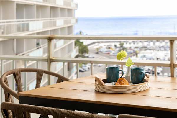 Sip your morning coffee on a private balcony while enjoying the mix of ocean and city views, all while soaking in the cool island breezes.