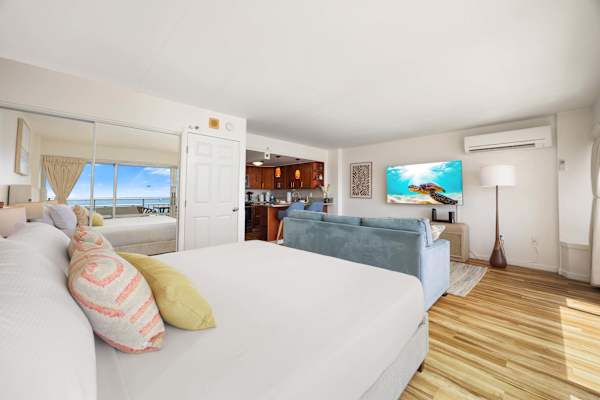 Beside the king bed is a dresser and a full-sized mirror for added convenience.