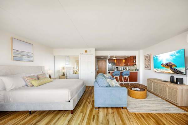 This studio features a modern layout that also maximizes the utility of each space. Unwind on the king-sized bed or simply relax a bit in the comfortable pull-out sofa while enjoying your favorite shows from the 65" Smart TV.