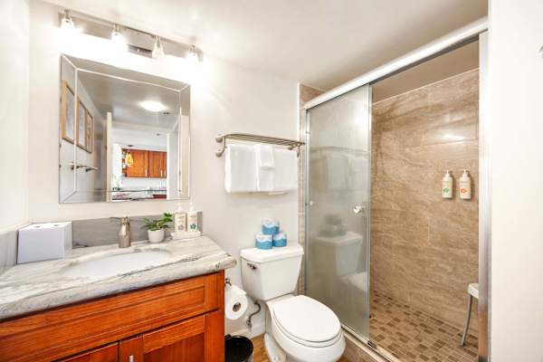 Refresh in your bathroom, complete with a vanity and a walk-in shower.