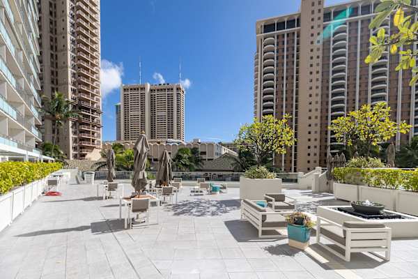 Enjoy outdoor dining in Ilikai Hotel's deck area