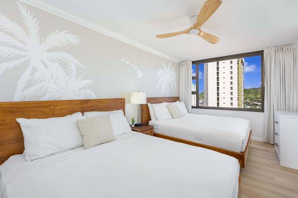 Relax in your bedroom with 2 queen beds, perfect for your restful evenings.