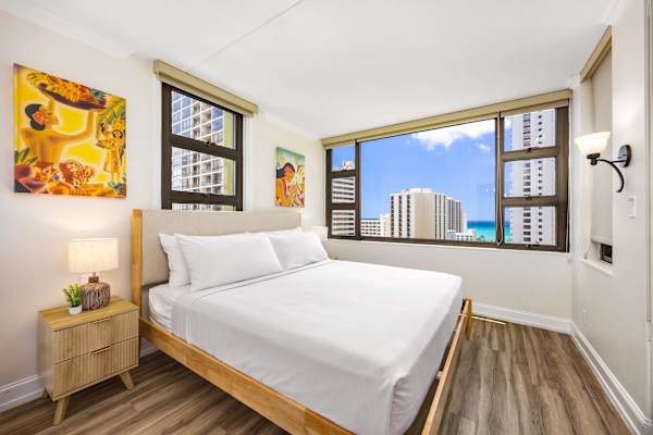 Relax on your king-size bed in the bedroom while enjoying the views from your window.