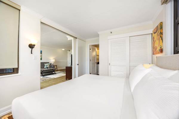 The bedroom is separated from the living area by a sliding door.