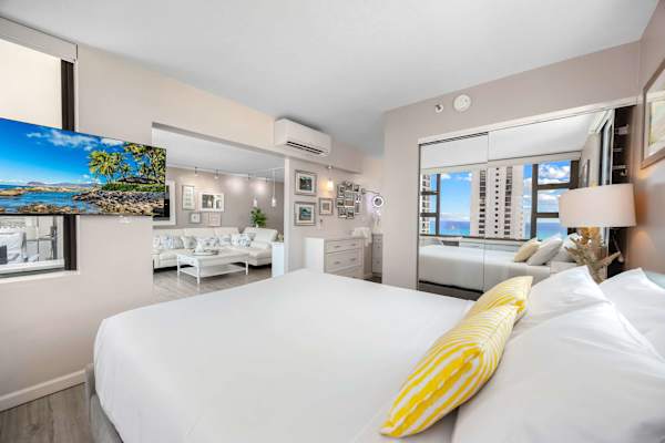 Bright bedroom with ocean views and modern decor
