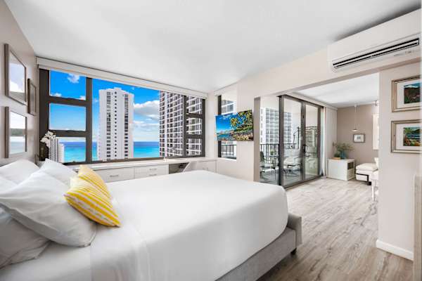Bright bedroom with ocean views and modern decor