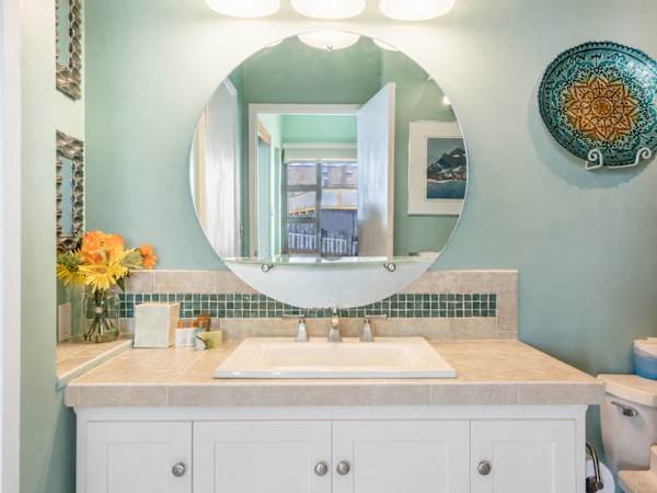 Full bathroom with vanity and cabinet