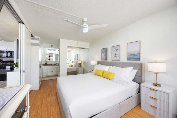 Feel the comfort of your bedroom with a king-size bed, a ceiling fan, a smart TV, and easy access to the bathroom.
