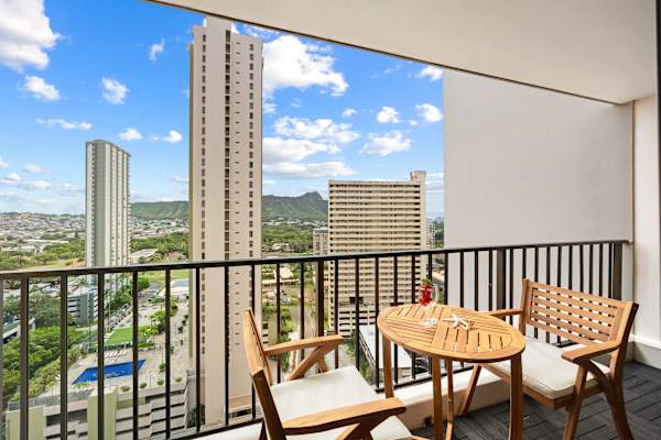 Sip a quick coffee or unwind at sunset on the cozy balcony with two outdoor seats and a table with sweeping city and mountain views.