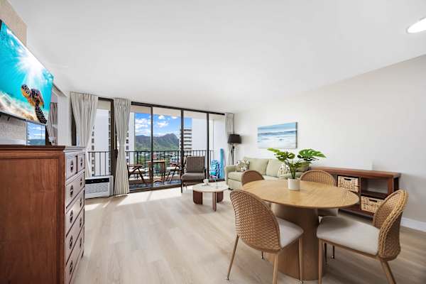 Seamless open-layout living room with abundant natural light, spacious, inviting, and perfectly designed for effortless entertaining and relaxation.