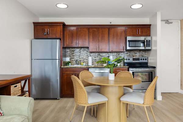The dining table seats four, perfect for shared meals and lively conversations.