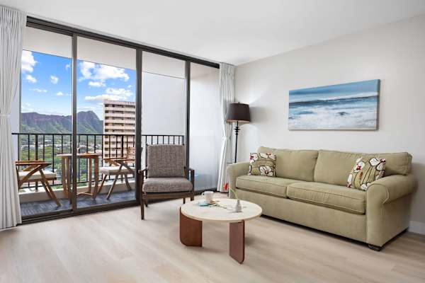 Relax in the living room with stunning mountain views, enjoy the panorama through a large glass window, or step onto the balcony for an up-close outdoor perspective.