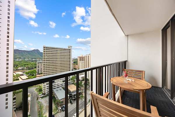 Sip a quick coffee or unwind at sunset on the cozy balcony with two outdoor seats and a table with sweeping city and mountain views.