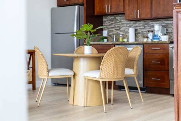 The dining table seats four, perfect for shared meals and lively conversations.