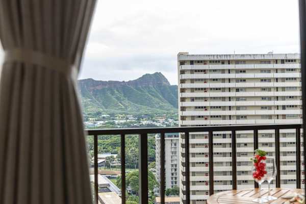 Sip a quick coffee or unwind at sunset on the cozy balcony with two outdoor seats and a table with sweeping city and mountain views.