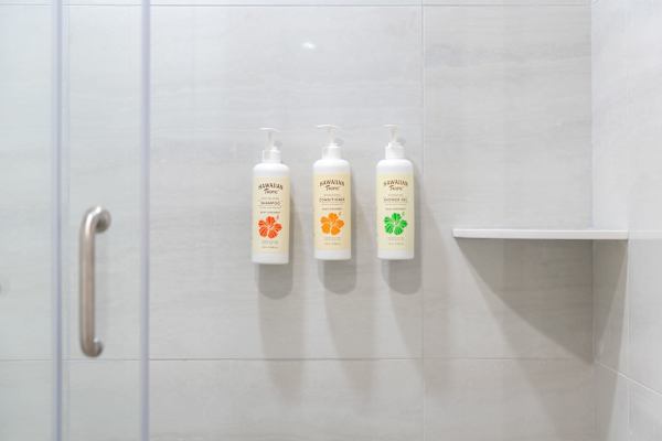 The unit's modern bathroom also comes with all your bathing essentials, including shampoo, conditioner, shower gel, and other toiletries.