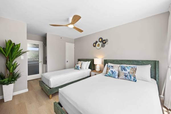 Bedroom with queen-sized and twin-sized beds