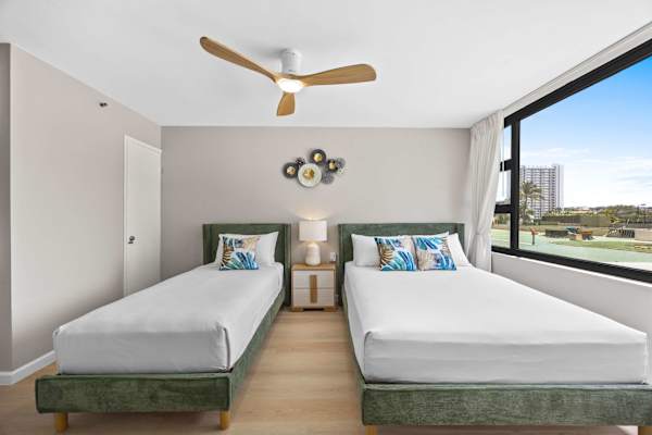 Bedroom with queen-sized and twin-sized beds