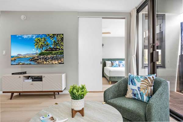 The living area and the bedroom are separated by a sliding door