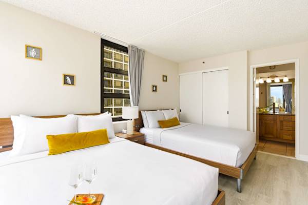 Your bedroom has 2 queen beds and easy access to the bathroom