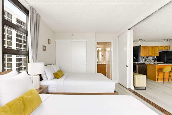 Your bedroom has 2 queen beds, closet, easy access to the bathroom, and a sliding door that separates it from the living area.