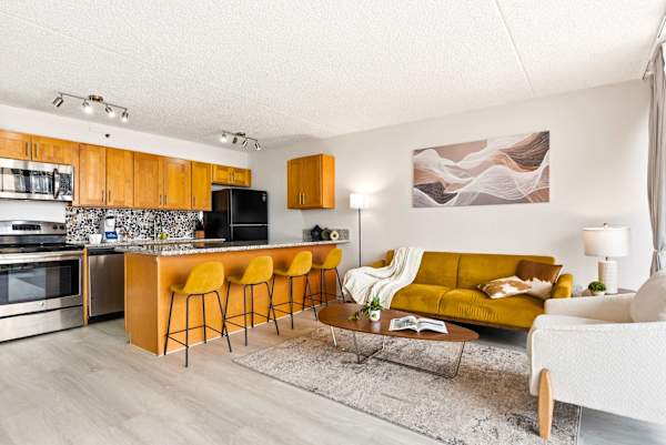 From casual morning coffees at the breakfast bar to cozy evenings on the sofa, this seamlessly integrated kitchen and living area is built for modern living.