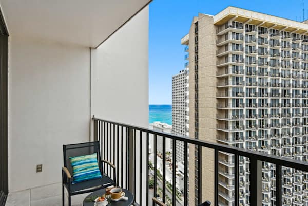 Sip your morning coffee from your private balcony while soaking in refreshing ocean breezes and towering city views.