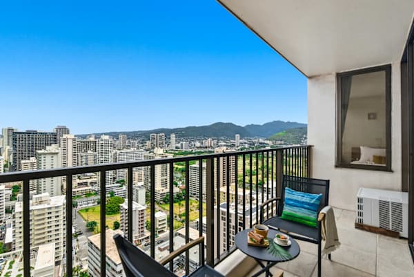 Take in sweeping cityscapes and lush mountain views from your private high-rise balcony.
