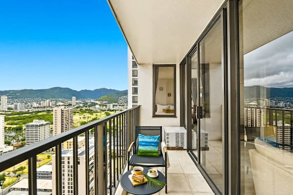 Take in sweeping cityscapes and lush mountain views from your private high-rise balcony.