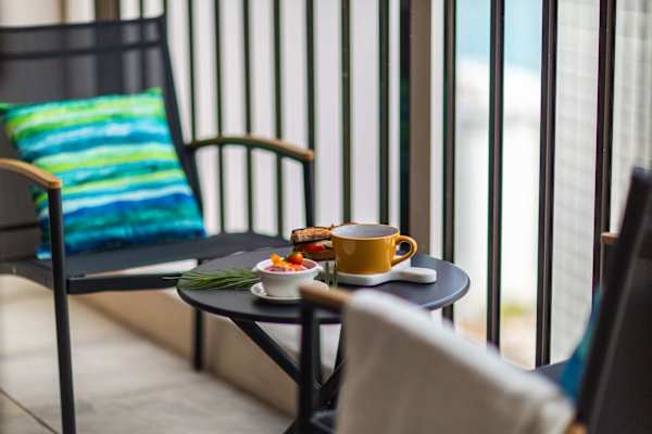 Start your morning with a breath of fresh air and breakfast for two on your private, cozy balcony.