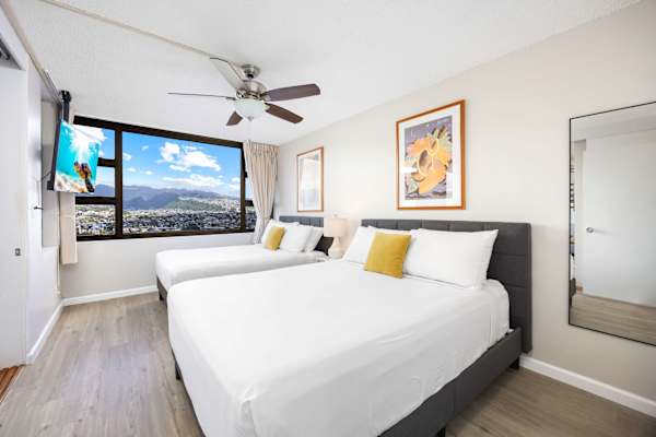 Sink into comfort in our cozy bedroom, featuring a plush queen-size bed and a comfortable full-size bed—perfect for couples, friends, or small families seeking a restful night’s sleep.